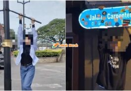 panjat papan tanda jalan DBKU